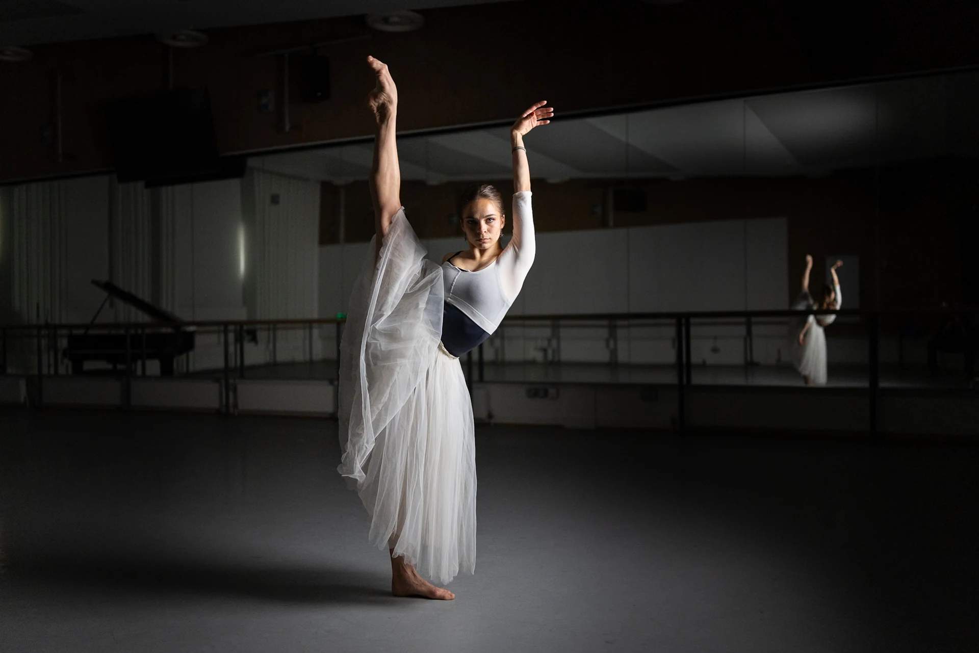 Dancer with both arms raised