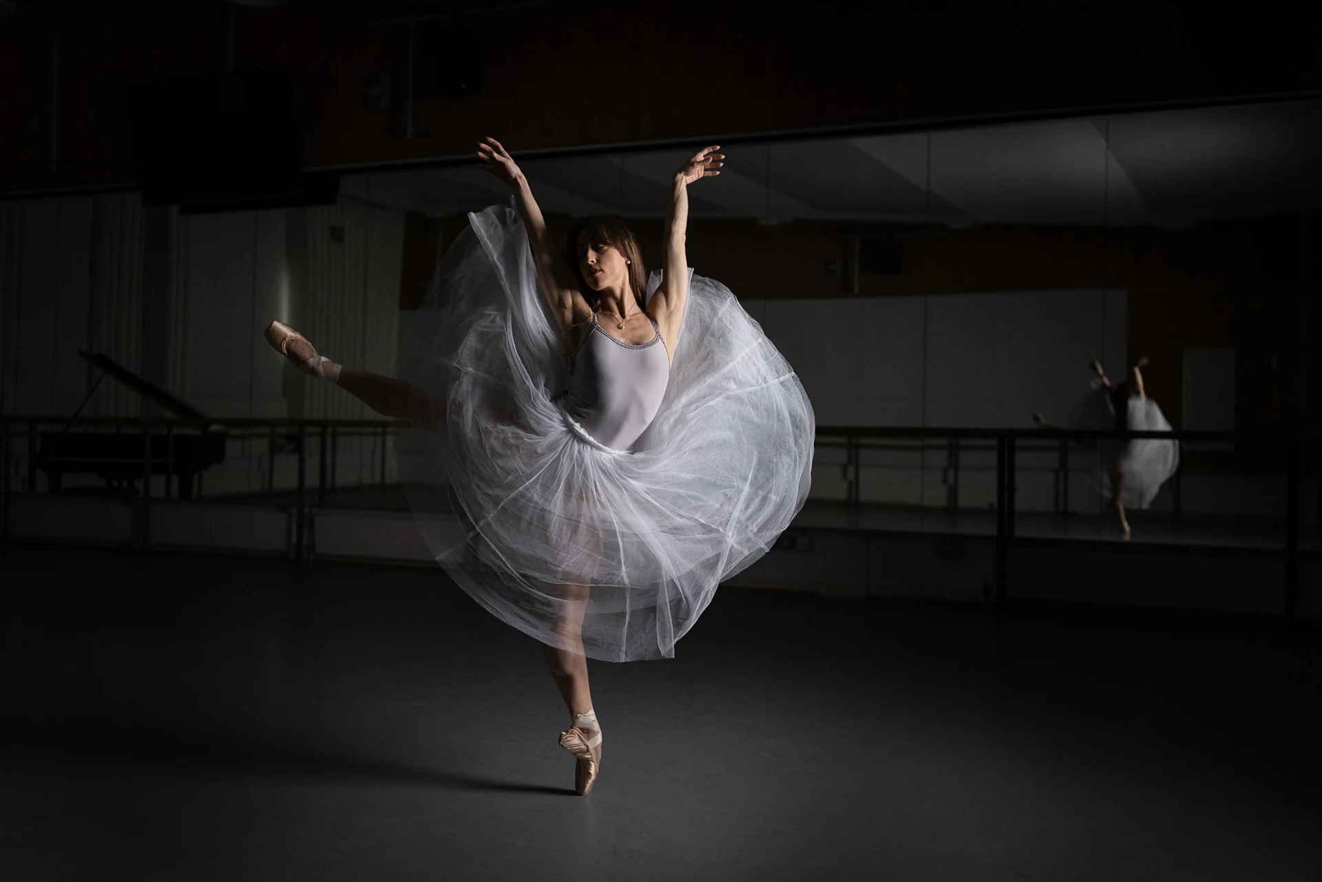 Dancer turning with billowing white tulle